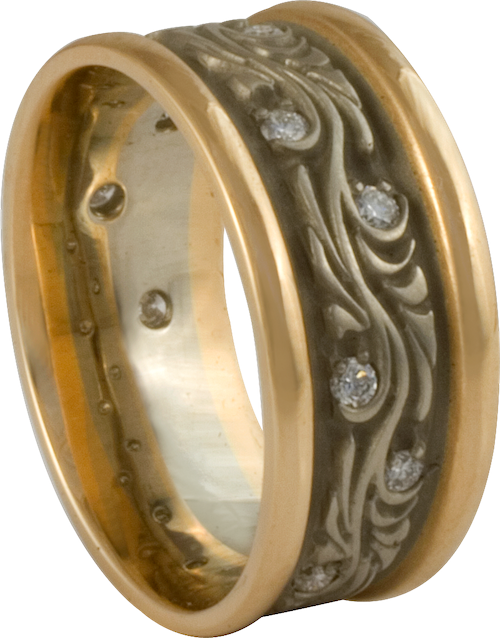 A wide gold wedding band allows more space for a design element, as show in our Starry Night two tone wedding ring.